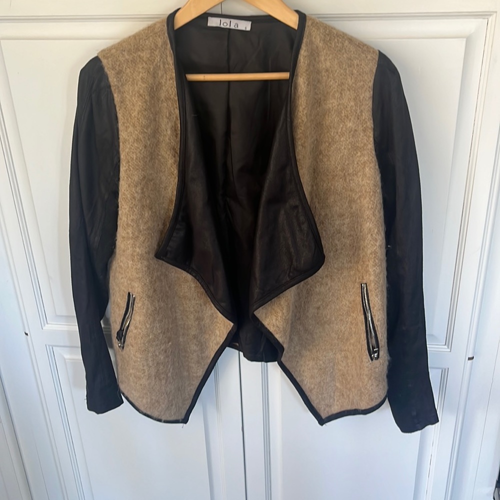 Adorable lite jacket. Lots of different material make it really pop.